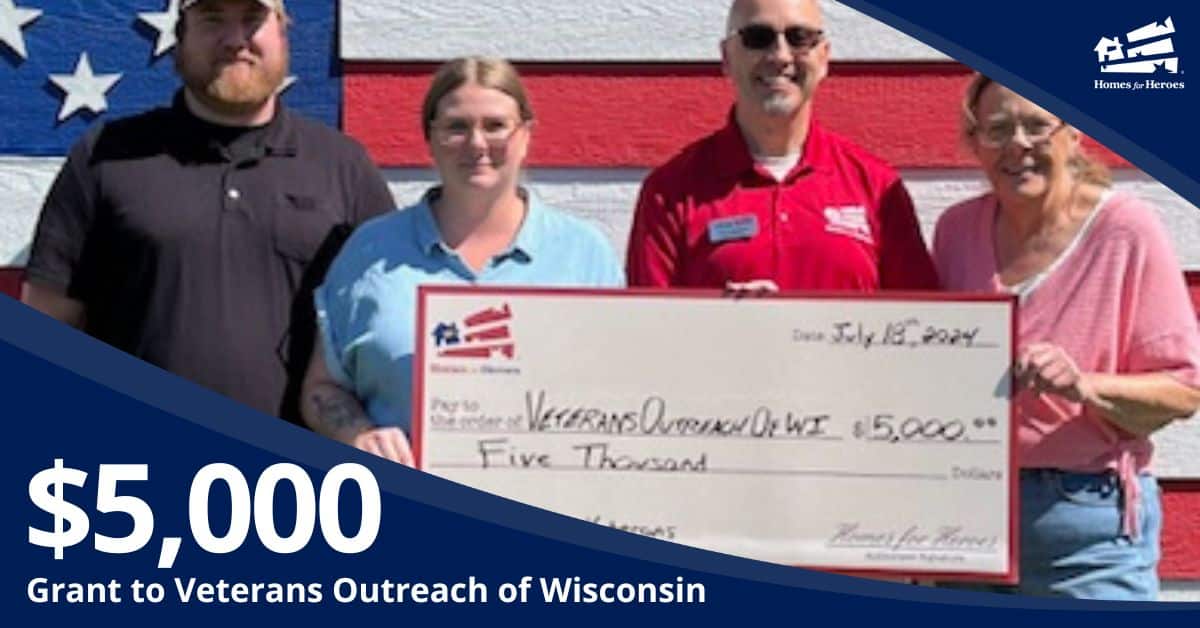 Veterans Outreach of Wisconsin grant check presentation four people in front of American flag wall Homes for Heroes Foundation