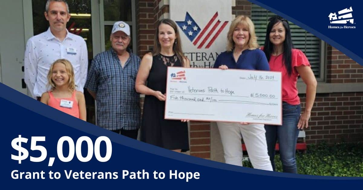 Veterans Path to Hope receives 5000 grant from Homes for Heroes Foundation outside holding big grant check