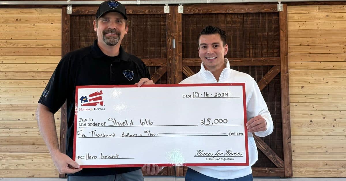 shield 616 grant 5000 jake shane holding big check oct 2024 Homes for Heroes Foundation