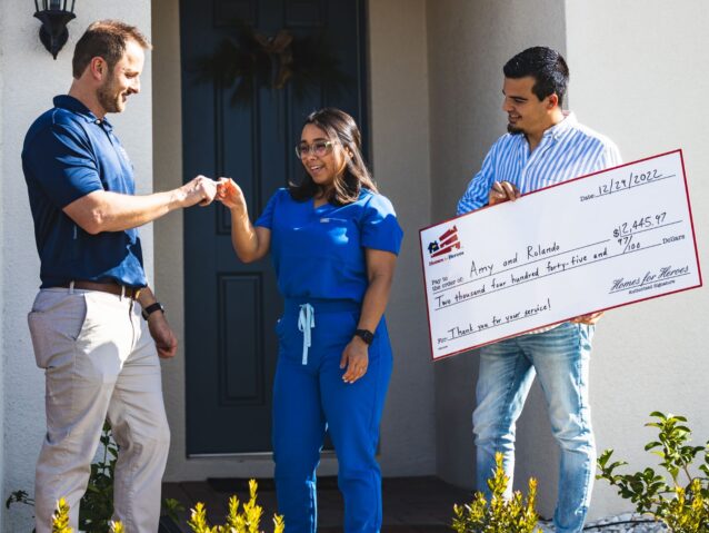 Amy and Rolando receiving keys to new home from affiliate