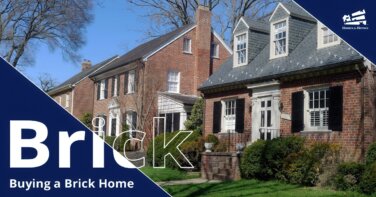 Multiple brick homes lining a street