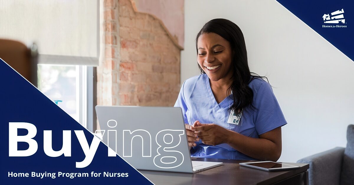 Woman nurse sitting at a computer smiling