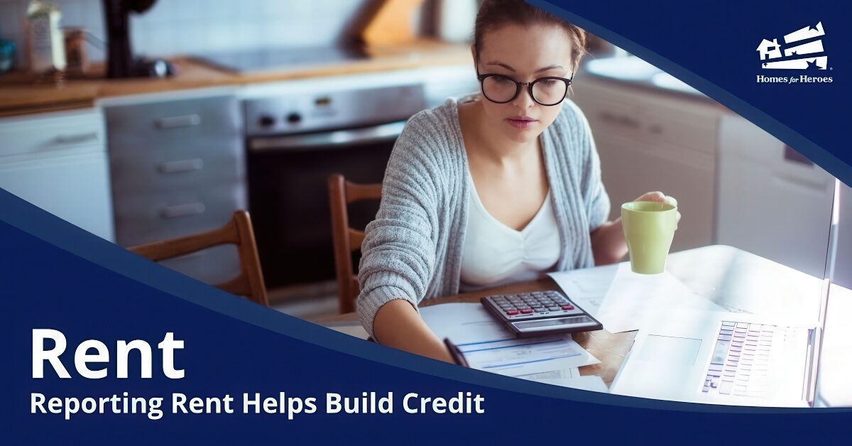 young woman wearing glasses holding coffee paying bills on laptop in kitchen preparing for rent reporting using rent reporting service Homes for Heroes