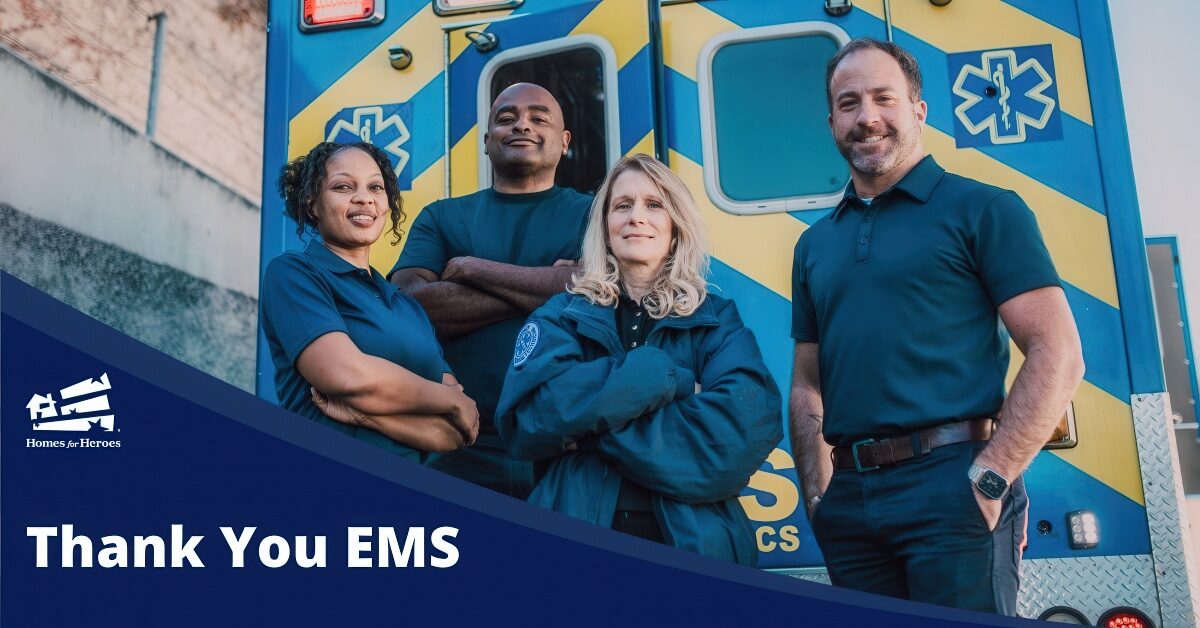 four emergency medical service members standing next to ambulance smiling thank you ems Homes for Heroes