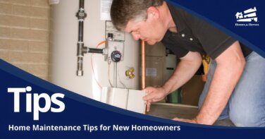 man on hands and knees checking water heater new homeowner home maintenance Homes for Heroes