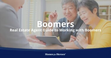 real estate agent working with baby boomers sitting at table in office looking at home listings on tablet Homes for Heroes