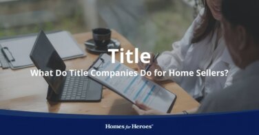 representative explaining what do title companies do for home seller sitting at desk reviewing title insurance Homes for Heroes