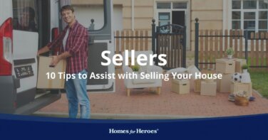 young man loading moving boxes outside of home preparing to sell your house with Homes for Heroes