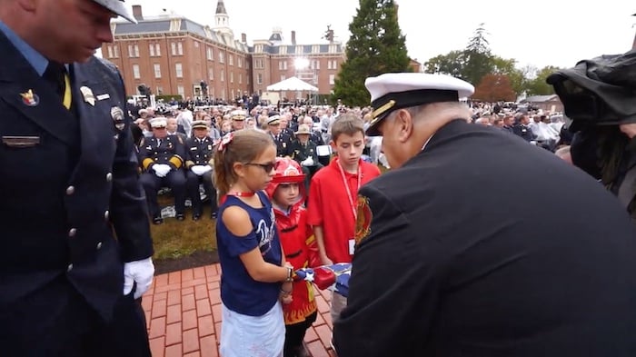 2023 national fallen firefighter foundation memorial service flag presentation to children of fallen firefighter