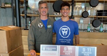 Travis Manion Foundation event volunteers 9/11 heroes run side by side smiling local restaurant