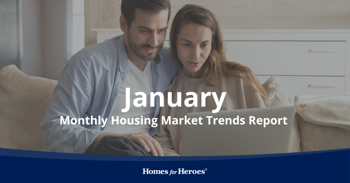 young couple on couch looking at housing market trends January on laptop Homes for Heroes