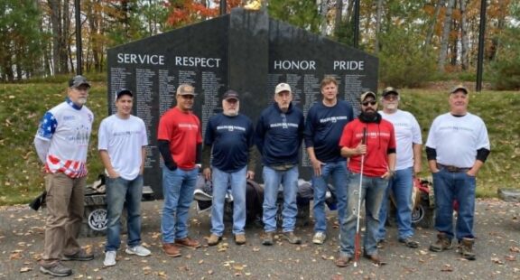 Presque Group Healing Patriots men in front of monument outside